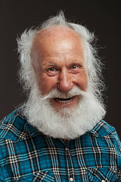 istock old man with a long beard with big smile 514437919