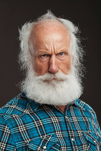 istock old man with a long beard with big smile 514437931
