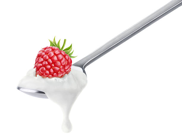 istock Spoon of yogurt with raspberry on top 514439423