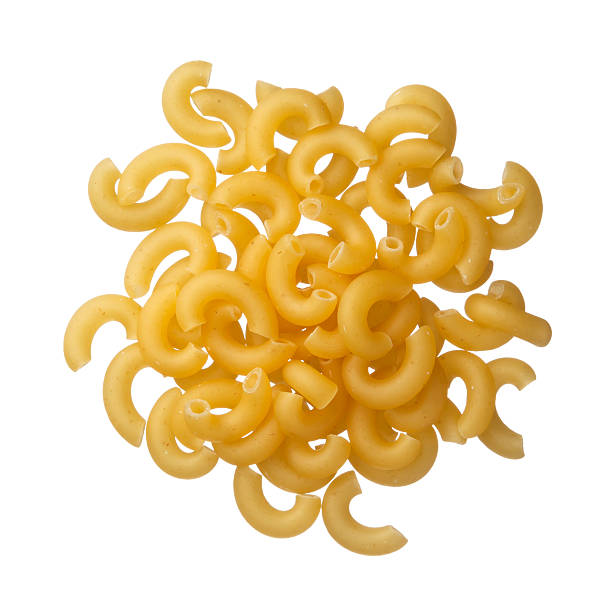 istock Italian raw pasta cornetti on a pile isolated on white 514440149