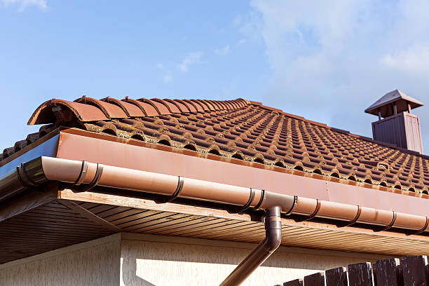 istock Red tiled roof with gutter and chimney 514440735