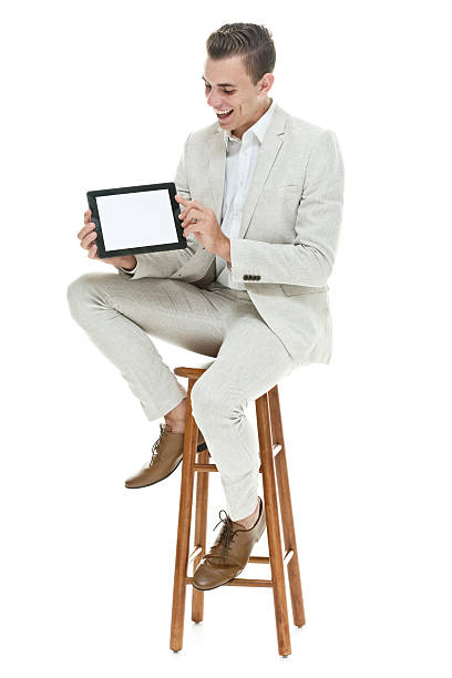 istock Smiling smart casual man showing tablet 514441713
