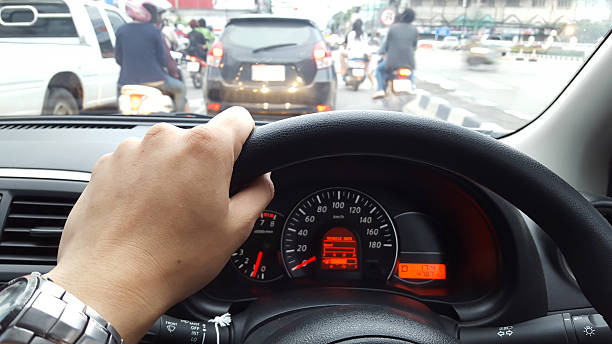 istock car driving at day,show instrument panel and traffic jam. 514453030