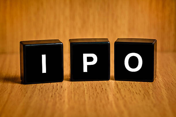 IPO or Initial public offering word on black block stock photo