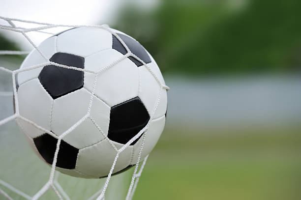 istock Soccer ball in goal 514454477