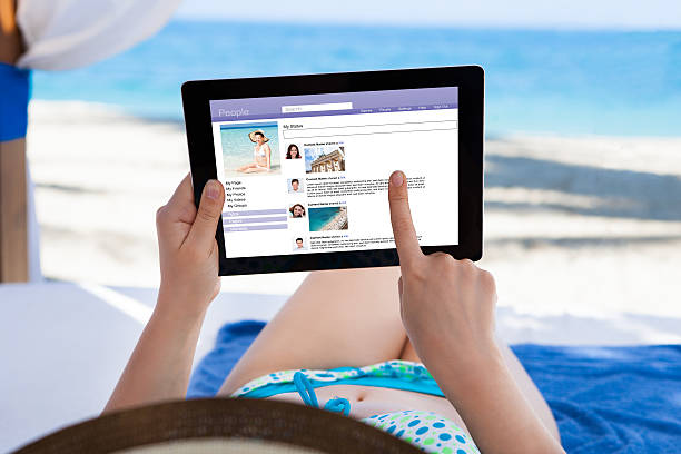 istock Woman Surfing On Social Site At Beach 514454785