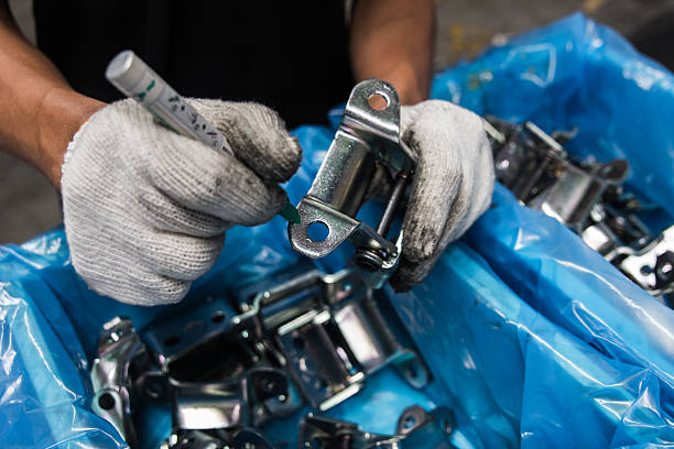 istock Workers inspect automotive parts. 514454875