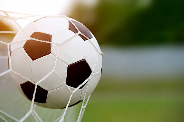 istock Soccer ball in goal 514455747