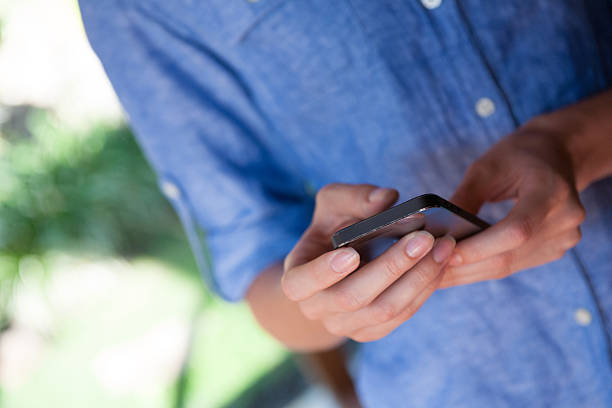 istock Woman holding smart phone 514455971