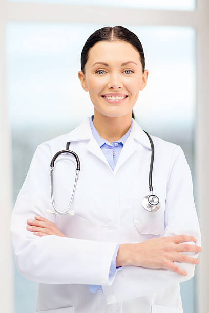 istock smiling young doctor with stethoscope in cabinet 514458311