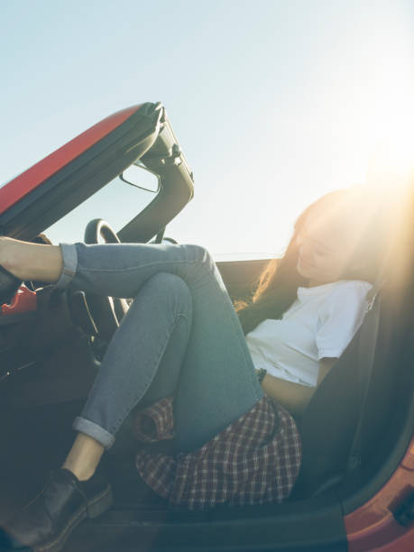 istock asian woman  using cellphone  in cabriolet 514458926