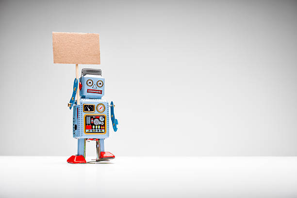 istock Retro tin toy robot holding up a sign 514460479