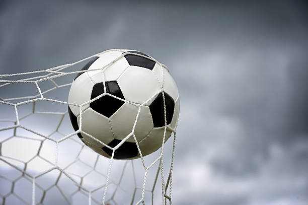 istock Soccer ball in goal 514460665