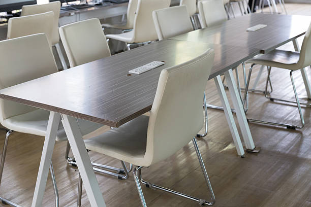 istock white leather chair and wooden table with socket 514460822