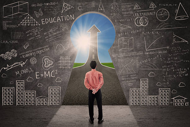 istock Businessman looking through keyhole and see up arrow sign 514461581