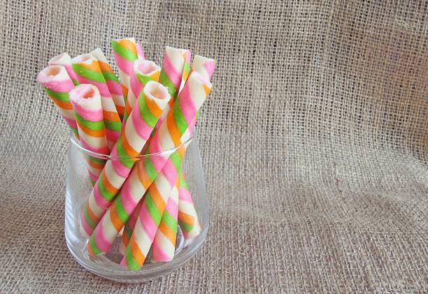 istock sweet wafer rolls in glass 514462958