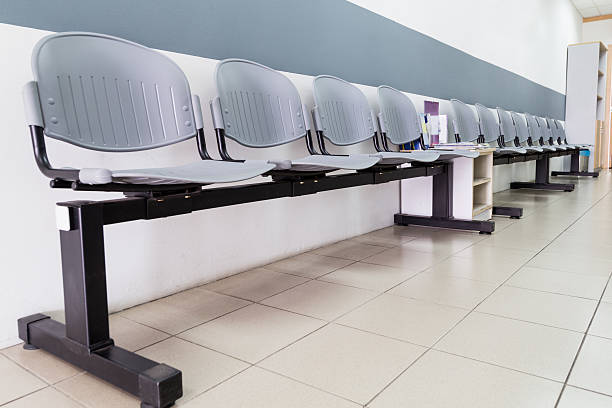 istock Closeup on row of empty chairs at reception of interior 514464346