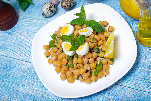 istock Dish of chickpeas with mint, olive oil and lemon 514467692