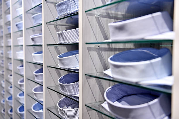 istock Elegant shirts on shelves in a store 514468250