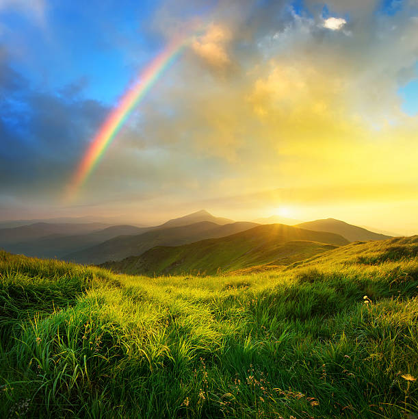 Mountain sunrise Mountain valley during sunrise. Natural summer landscape rainbow stock pictures, royalty-free photos & images