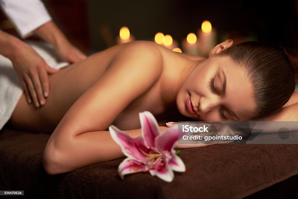 Woman paying visit at massage therapist Adult Stock Photo
