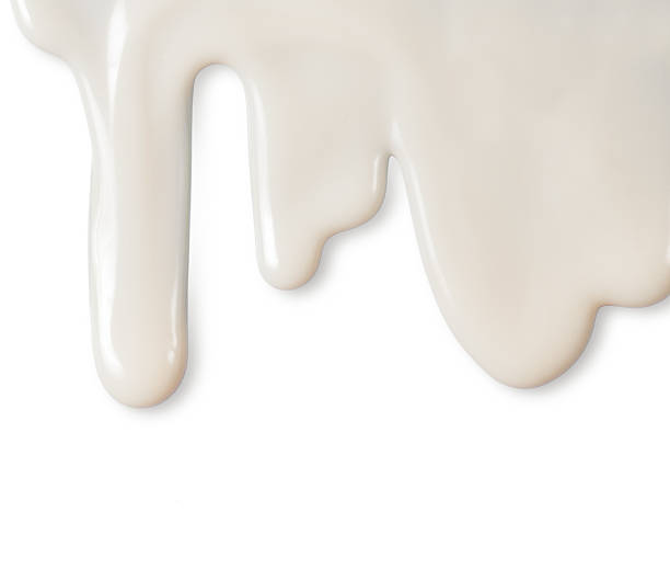 istock Dripping white milk, cream, paint yogurt on white background 514473796