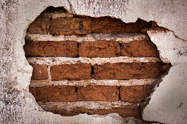 istock Brick,concrete weathered grunge wall background 514474374