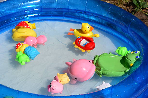 istock Little girl bathes in inflatable pool 514477671