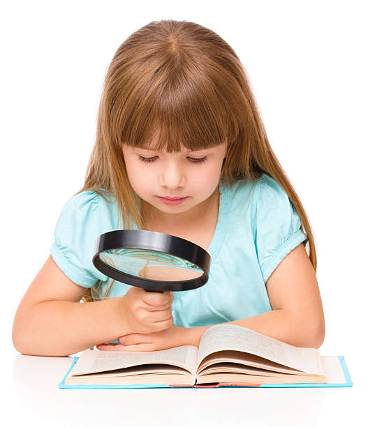 istock Cute girl is reading book 514478099