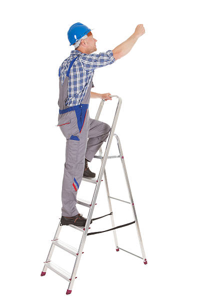 istock Repairman Climbing Step Ladder 514480259