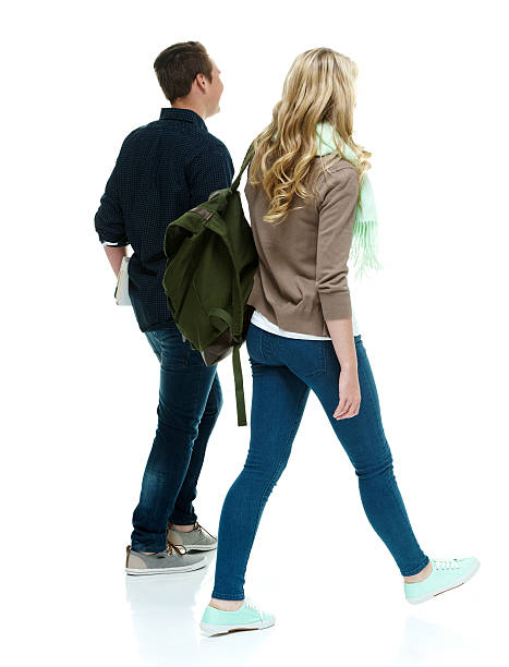 istock Rear view of two students walking 514480953