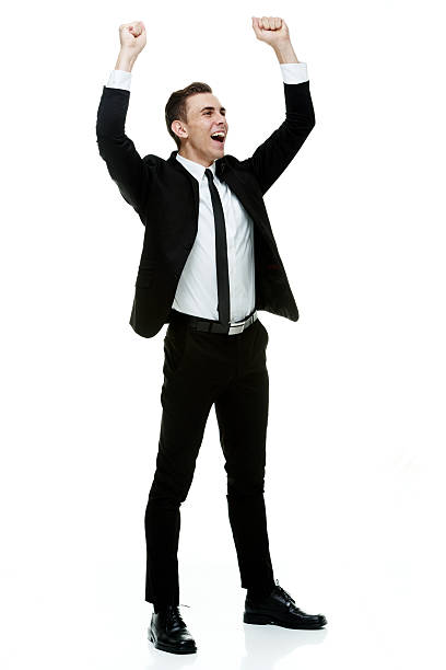 istock Smiling businessman cheering with hands raised 514480987