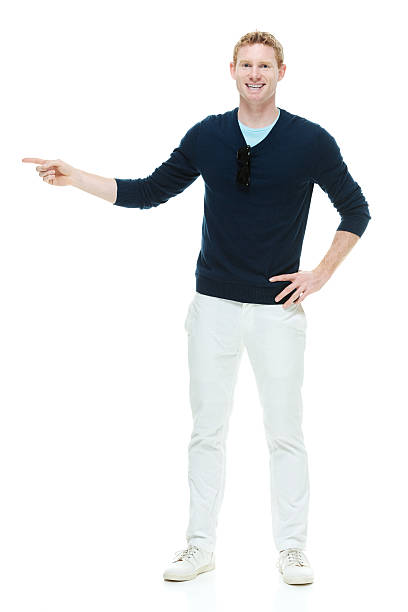 istock Cheerful casual man pointing away 514480995