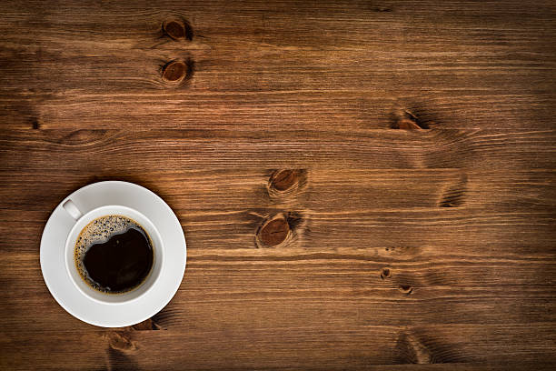 istock Coffee cup top view on wooden table background 514482423