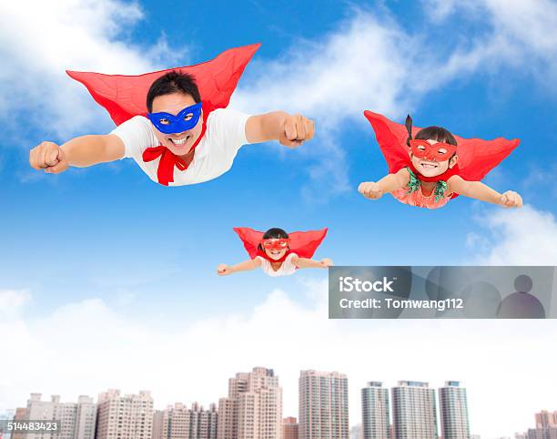 Superman And Daughters Flying In The Sky Stock Photo - Download Image Now - Father, Asia, Superhero