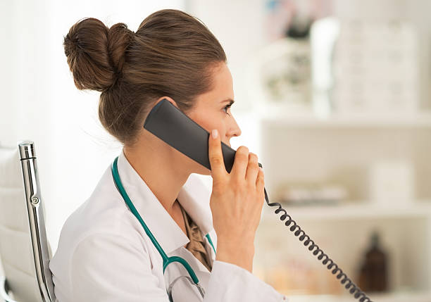 istock doctor woman talking phone in office 514498206