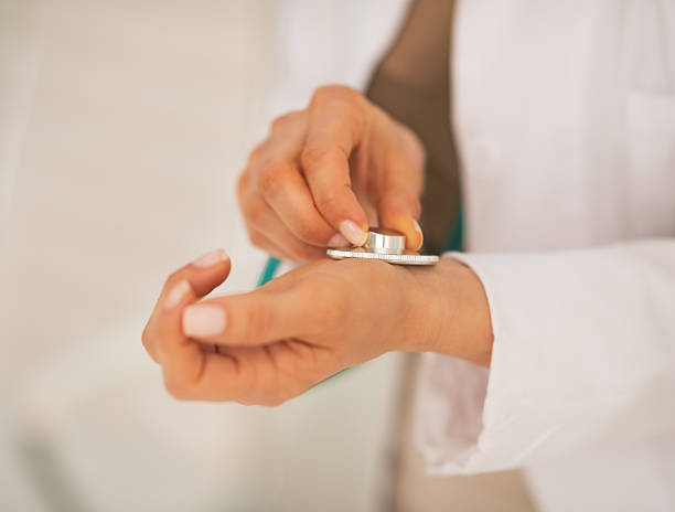 istock closeup on doctor woman measuring pulse 514499050