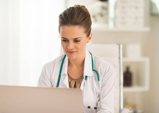 istock doctor woman working on laptop in office 514499548