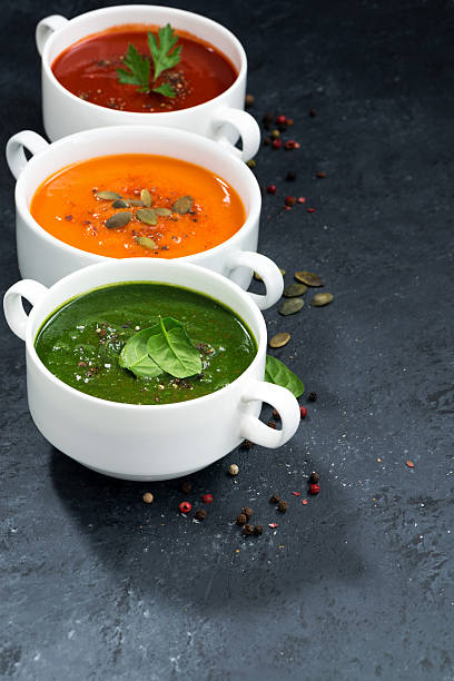 istock assortment of fresh vegetable cream soup on and dark background 514501812