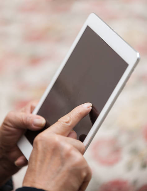 istock Old Asian man touch digital tablet indoors 514502094