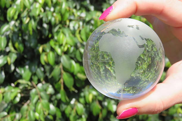 istock Green planet Earth in hand 514502524