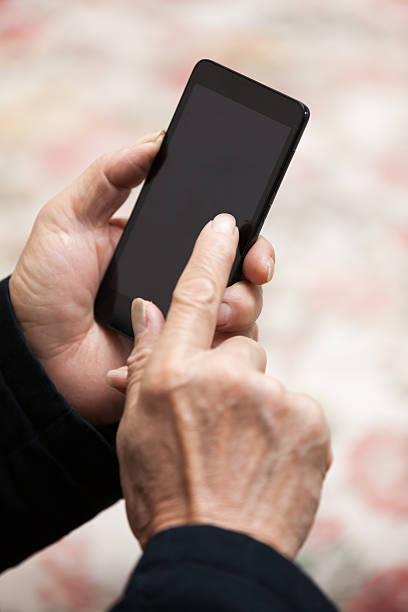 istock Asian old man use smart phone indoors 514509382
