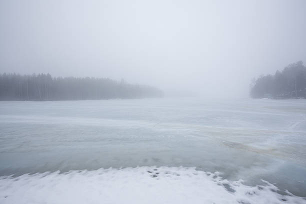 istock Thick fog at frozen lake landscape 514509558