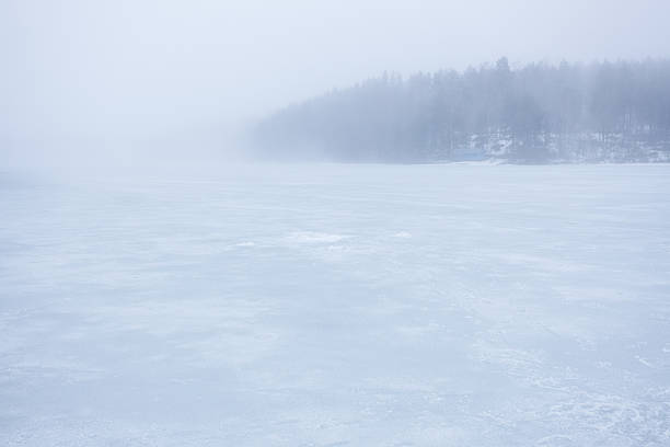 istock Thick fog at frozen lake landscape 514510096