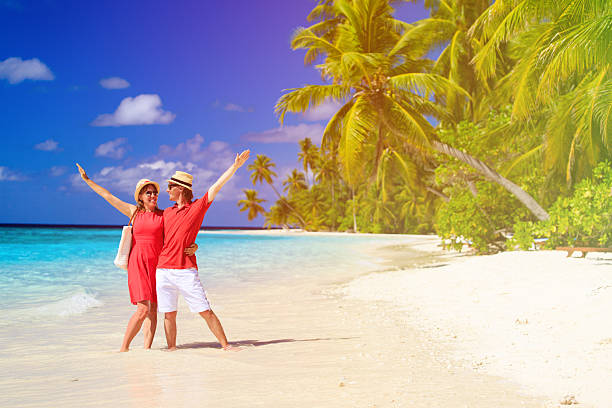 istock happy loving couple on summer beach 514510220