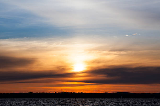 istock Calm sunset and clouds over lake 514511544