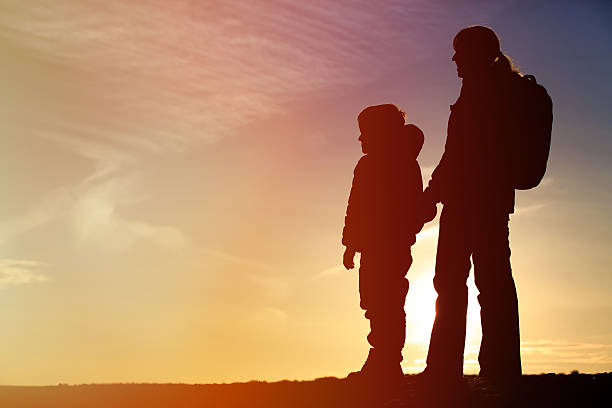 istock mother and son travel at sunset 514511702