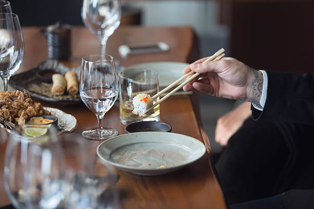 istock Businessman eating sushi 514512018
