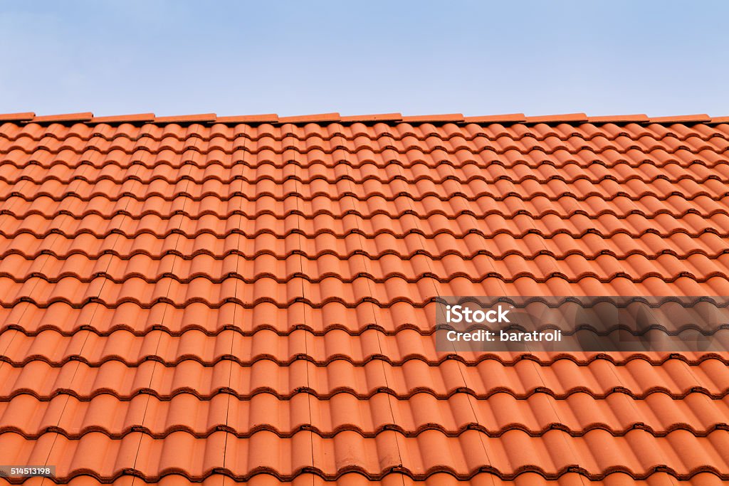 Tile roofs, patterns Tile roofs, patterns of blue sky Roof Tile Stock Photo