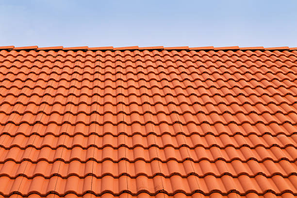 Tile roofs, patterns Tile roofs, patterns of blue sky roof tile photos stock pictures, royalty-free photos & images